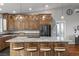 Large kitchen island with bar seating, stainless appliances, wooden cabinets, and granite countertops at 2590 Luke St, Pahrump, NV 89060