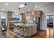 Gourmet kitchen features custom wood cabinets, granite countertops, and stainless steel appliances for an ideal cooking experience at 2590 Luke St, Pahrump, NV 89060