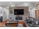 Cozy living room with stone accent wall, fireplace, and comfortable seating, perfect for relaxing and entertaining guests at 2590 Luke St, Pahrump, NV 89060