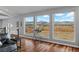 Bright living area boasting expansive windows with desert views and hardwood floors, creating an inviting atmosphere at 2590 Luke St, Pahrump, NV 89060