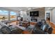 Spacious living room featuring hardwood floors, modern fireplace, and large windows showcasing the desert landscape at 2590 Luke St, Pahrump, NV 89060