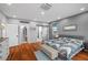 Large main bedroom with hardwood floors, custom closet doors, and ensuite bathroom at 2590 Luke St, Pahrump, NV 89060