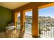 Private balcony with outdoor seating offers picturesque views of the surrounding landscape and mountains at 30 Strada Di Villaggio # 521, Henderson, NV 89011