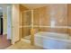Bright bathroom featuring tiled shower and separate soaking tub for relaxation at 30 Strada Di Villaggio # 521, Henderson, NV 89011