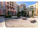 Beautifully landscaped courtyard with fire pit and seating at 30 Strada Di Villaggio # 521, Henderson, NV 89011