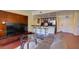 Living room with a breakfast bar, modern appliances, and a cozy sofa for relaxation at 30 Strada Di Villaggio # 521, Henderson, NV 89011
