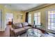Bright living room features an access door to the outside and hardwood flooring at 30 Strada Di Villaggio # 521, Henderson, NV 89011