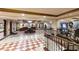 Spacious lobby area with elegant flooring, staircase, and reception desk at 30 Strada Di Villaggio # 521, Henderson, NV 89011