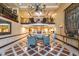 Grand lobby area with high ceilings, elegant chandelier, and comfortable seating, creating a welcoming atmosphere at 30 Strada Di Villaggio # 521, Henderson, NV 89011