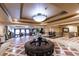 Lobby area with chandeliers, seating, and elegant tiled flooring at 30 Strada Di Villaggio # 521, Henderson, NV 89011