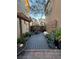 Backyard patio with lush greenery and stylish decor, creating a relaxing outdoor space at 3160 Del Dotto Walk, Henderson, NV 89044