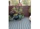 Outdoor space featuring a decorative wooden fence and potted plants at 3160 Del Dotto Walk, Henderson, NV 89044