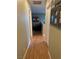 Hallway with hardwood floors leading to living room with large tree art piece at 3160 Del Dotto Walk, Henderson, NV 89044