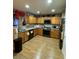 Well-equipped kitchen featuring stainless steel appliances, ample cabinet space, and laminate floors at 3160 Del Dotto Walk, Henderson, NV 89044