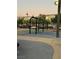 Park playground features swings, benches, and shady trees, creating a relaxing atmosphere for community members at 3160 Del Dotto Walk, Henderson, NV 89044