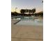 This pool features clear water, lounge seating, trees, and shade canopies at 3160 Del Dotto Walk, Henderson, NV 89044