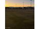 Vast community soccer field at dusk provides a serene space for recreation and sports activities at 3160 Del Dotto Walk, Henderson, NV 89044