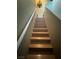 Elegant wooden staircase featuring contemporary design elements and neutral wall tones at 3160 Del Dotto Walk, Henderson, NV 89044