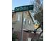 Street sign view of neighborhood homes behind a privacy wall and landscaping at 3160 Del Dotto Walk, Henderson, NV 89044