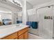 This is a bathroom with a glass enclosed shower, vanity, and neutral tile at 320 Cimmarron Pl, Pahrump, NV 89048