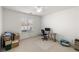 This bedroom has carpet and a double window and a ceiling fan at 320 Cimmarron Pl, Pahrump, NV 89048