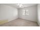 A standard bedroom featuring carpet, a window and ceiling fan at 320 Cimmarron Pl, Pahrump, NV 89048