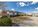Well-maintained single-story home with a three-car garage and front yard landscaping at 320 Cimmarron Pl, Pahrump, NV 89048