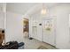 Bright foyer featuring tile flooring, an archway, a decorative door and a modern light fixture at 320 Cimmarron Pl, Pahrump, NV 89048