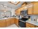 The kitchen has stainless steel appliances and granite countertops and recessed lighting at 320 Cimmarron Pl, Pahrump, NV 89048