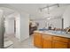 The kitchen has a breakfast bar and stainless steel refrigerator near living and dining area at 320 Cimmarron Pl, Pahrump, NV 89048