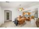 Cozy kitchen and dining area with wood cabinets, tile flooring and a ceiling fan with a light fixture at 320 Cimmarron Pl, Pahrump, NV 89048