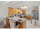 This kitchen has a breakfast bar with seating, lots of cabinet storage and stainless steel appliances at 320 Cimmarron Pl, Pahrump, NV 89048