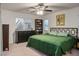 Bedroom with a ceiling fan, a large window with blinds, and ample closet space at 340 Largo Vista Ct, North Las Vegas, NV 89084
