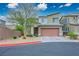 Charming two-story home with desert landscaping, brick driveway and two-car garage at 340 Largo Vista Ct, North Las Vegas, NV 89084