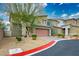 Charming home with desert landscaping, brick driveway and a two-car garage at 340 Largo Vista Ct, North Las Vegas, NV 89084