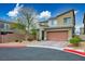 Attractive two-story house with desert landscaping, two-car garage, and modern architectural design at 340 Largo Vista Ct, North Las Vegas, NV 89084