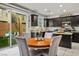 Bright eat-in kitchen featuring dark wood cabinets, stainless steel appliances, and a view to backyard at 340 Largo Vista Ct, North Las Vegas, NV 89084