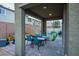 Covered patio featuring outdoor dining with stylish blue chairs, perfect for entertaining or relaxing at 340 Largo Vista Ct, North Las Vegas, NV 89084
