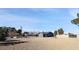 Wide shot of the large backyard with in-ground pool, picnic table and block perimeter fence at 3675 W Maule Ave, Las Vegas, NV 89118