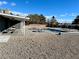 Spacious backyard with pool, picnic tables, and patio perfect for outdoor entertaining at 3675 W Maule Ave, Las Vegas, NV 89118