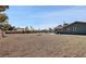 Expansive backyard showing the home, pool, and storage shed provides ample outdoor space at 3675 W Maule Ave, Las Vegas, NV 89118