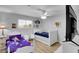 Bright bedroom featuring two twin beds, hardwood floors, and a ceiling fan at 3675 W Maule Ave, Las Vegas, NV 89118