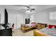 Inviting bedroom featuring twin beds, storage furniture, and a ceiling fan at 3675 W Maule Ave, Las Vegas, NV 89118