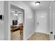 Bright entryway featuring light grey walls, wood look tile floor and bedroom view at 3675 W Maule Ave, Las Vegas, NV 89118
