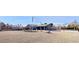 Spacious yard featuring rock landscaping, decorative wagon and perimeter wall at 3675 W Maule Ave, Las Vegas, NV 89118