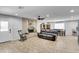 Spacious living room featuring tile floors, fireplace, ceiling fan and an open floor plan at 3675 W Maule Ave, Las Vegas, NV 89118