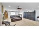Bright living room features an open floor plan, fireplace, ceiling fan and tile flooring at 3675 W Maule Ave, Las Vegas, NV 89118