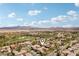 An aerial view of the property shows a desirable location with lush surroundings and mountain views at 3863 Glasgow Green Dr, Las Vegas, NV 89141