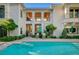 Backyard showcasing a pool, manicured lawn, and the home's architecture at 3863 Glasgow Green Dr, Las Vegas, NV 89141