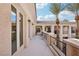 This balcony has metal railings, pillars and two palm trees at 3863 Glasgow Green Dr, Las Vegas, NV 89141